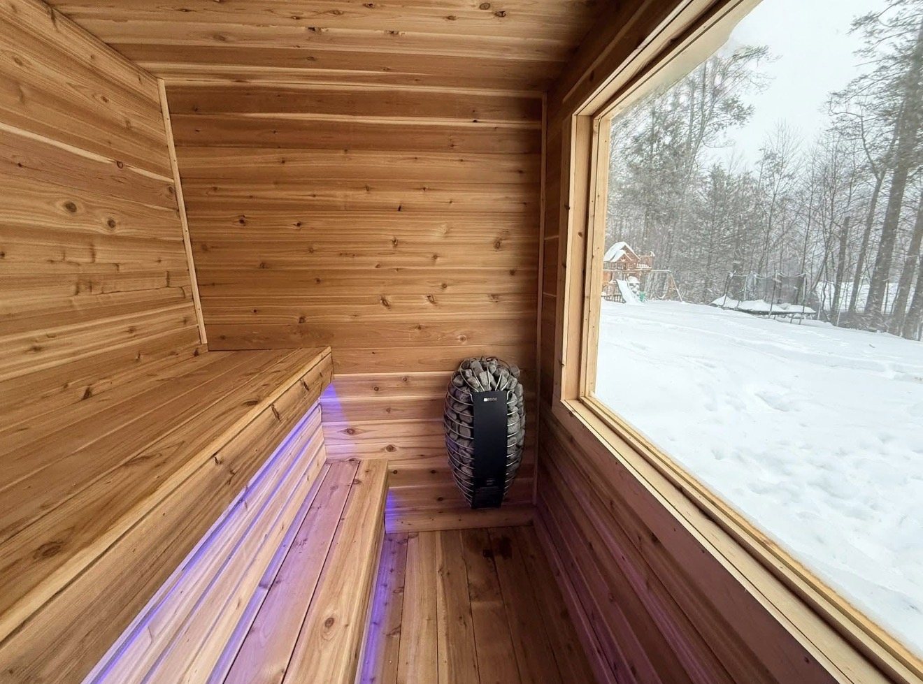 Sauna interior with a snowy backyard view, shared by Rod Engblom.